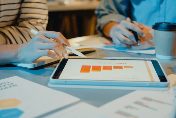 Two person using a tablet