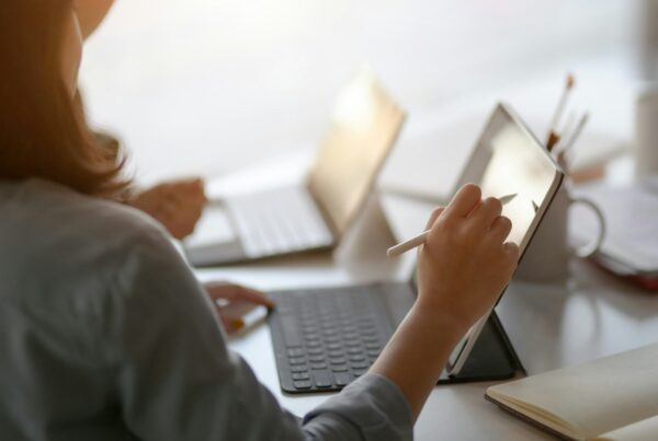 A woman holding a pen