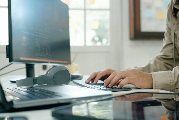 A person typing on a keyboard