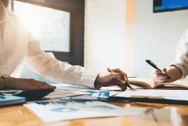 A person pointing using a pen