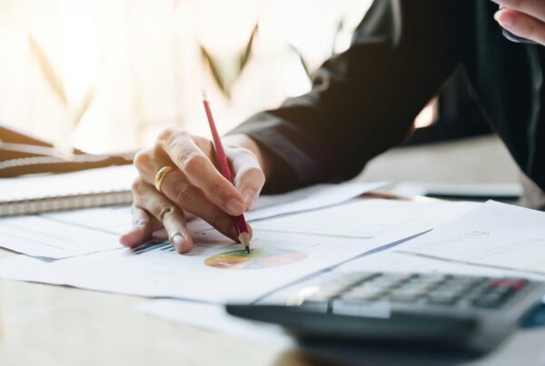 A person writing on a paper