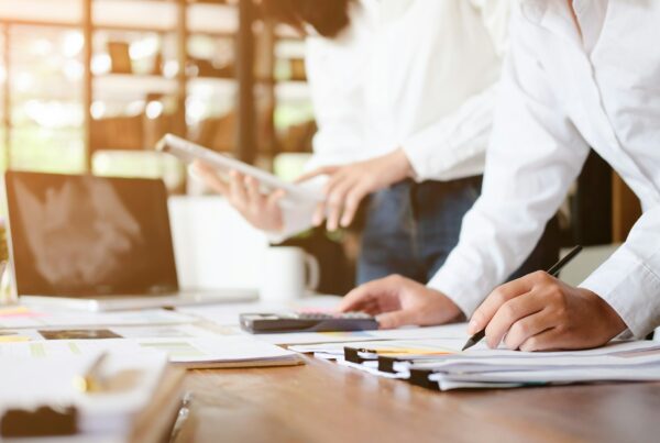 A person writing on a paper